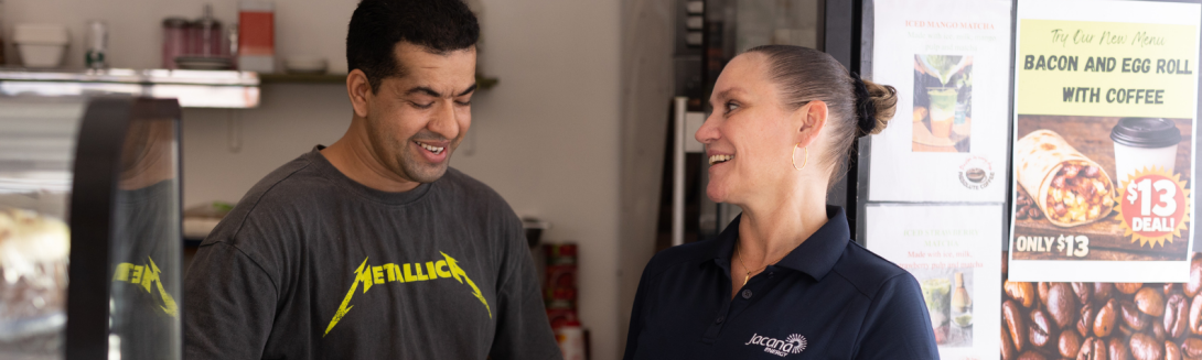 Jacana Energy employee talking to cafe owner